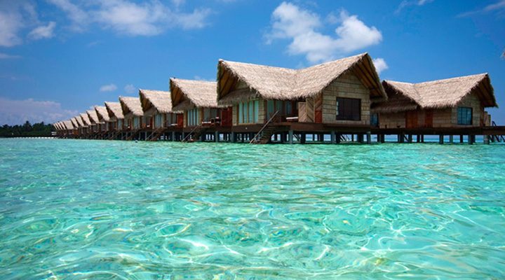 hudhuranfushi Resort Maldives over water villas surfing Lohis left